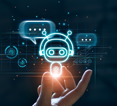 hand with illuminated robot or chatbot and speach bubbles